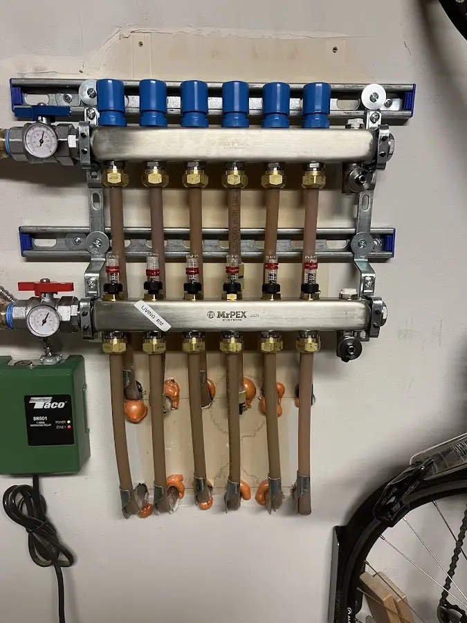 Plumber performing Gas Leak Detection at a residential property in Queensbury